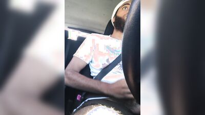 Rock Mercury plays with his big dick inside the car