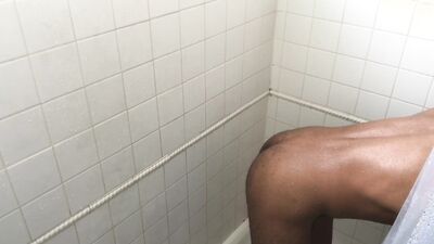 Rock Mercury is posing naked and taking a hot shower