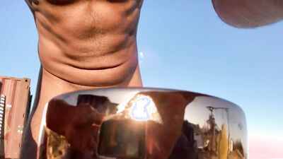 Fit and sexy dude oils his body and fools around naked outdoors