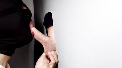 Gimp sucks a hard cock and deepthroats on it through a gloryhole.