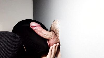 Masked man takes a cock in his mouth and sucks it nicely