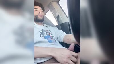 Dude gets horny in the car and plays with his hard pecker