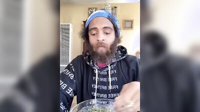 Cute guy with a sexy beard has fun reviewing food