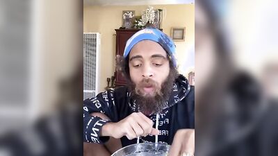 Cute guy with a sexy beard has fun reviewing food