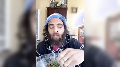 Cute guy with a sexy beard has fun reviewing food