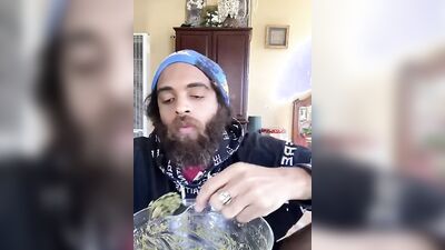 Cute guy with a sexy beard has fun reviewing food