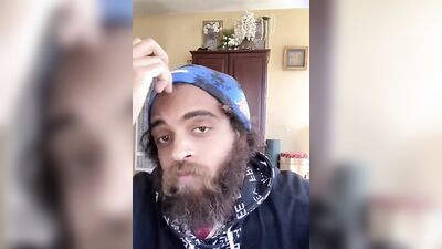 Cute guy with a sexy beard has fun reviewing food