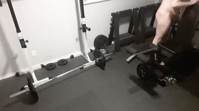 Kinky chubby guy strips naked and exercises in the gym