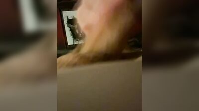 Horny man is filming his pecker with a phone while jerking off