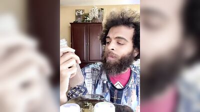 Dashing guy with a sexy beard does a juicer review