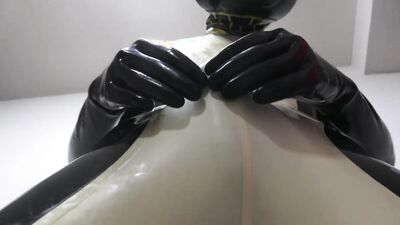 Sissy in Latex is rubbing his dick in this BDSM video