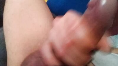 Inked man grabs his dick to stroke it for the camera