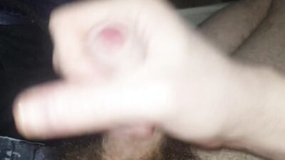 Hairy guy plays with his cock, jizzes, pisses and films it all
