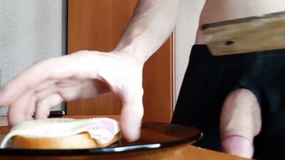 Perverted guy jerks off and jizzes all over his sandwich