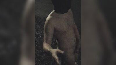 Pervert walks naked on the street and jerks off on a dirty ground