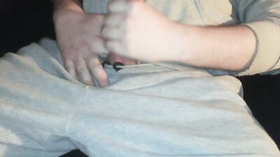Dirty man is spanking his monkey while watching a movie
