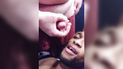 Horny black lad jerks off and white guy jizzes on his face