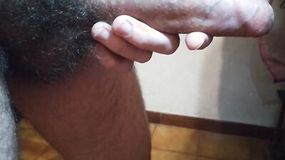 Horny lad is playing with his massive cock in front of the camera