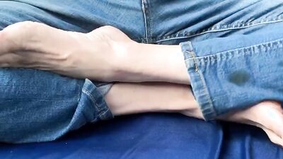 Horny man is showing his feet and toes from up close