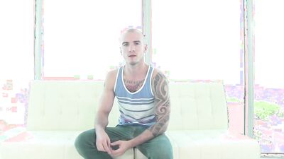 Inked blonde chum is stroking his dick while being fucked in the ass
