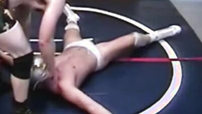 Two gay lads are wrestling half naked on the floor