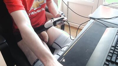 Horny guy touches his cock while playing a video game