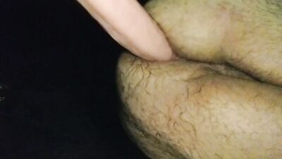 Hairy guy is stretching his ass with a humongous sex toy