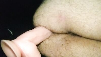 Hairy guy is stretching his ass with a humongous sex toy