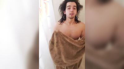 Long-haired guy takes a shower and plays with his pecker