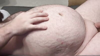 A small-dicked fat man is playing with his belly button