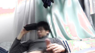 Asian guy is watching gay porn on his phone while jerking off