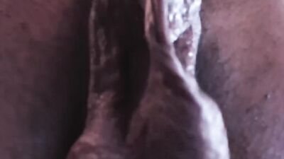 Inked black guy is chatting with his fans while jerking off