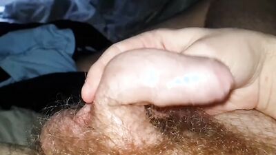 Horny amateur plays with his uncut dick and hairy balls