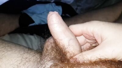 Horny amateur plays with his uncut dick and hairy balls