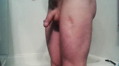 Guy smokes a cigar and strokes cock while sitting on a dildo