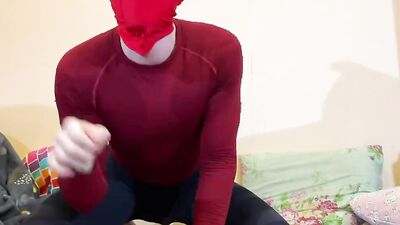Kinky guy poses in Deadpool costume and plays with his small cock