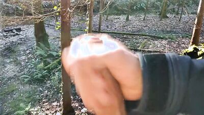Horny lad is filing his hard pecker while jerking off by the creek