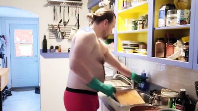 Gay dude is making a breakfast shirtless in the kitchen