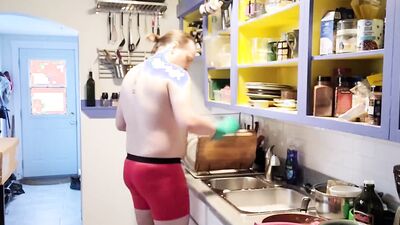 Gay dude is making a breakfast shirtless in the kitchen