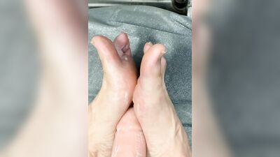 Naughty guy is practicing footjob skills on that big dildo