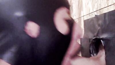 Gimp licks that hard cock and sucks it through a gloryhole