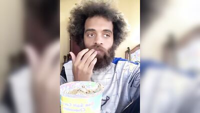 Lovely guy with a cute beard does a food review