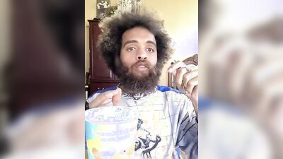 Lovely guy with a cute beard does a food review