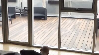 wetsuited silicone masked guy cums on his dummy at patio windows