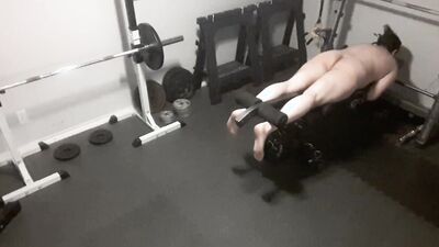 Exhibitionistic chubby guy is working out naked in the gym