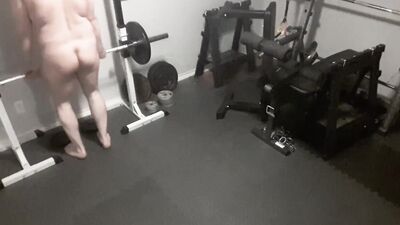 Exhibitionistic chubby guy is working out naked in the gym