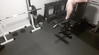 Exhibitionistic chubby guy is working out naked in the gym