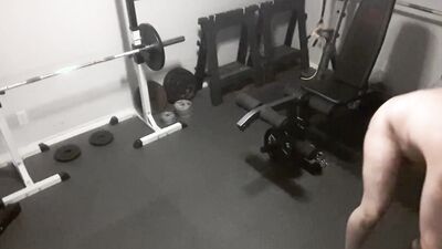 Exhibitionistic chubby guy is working out naked in the gym