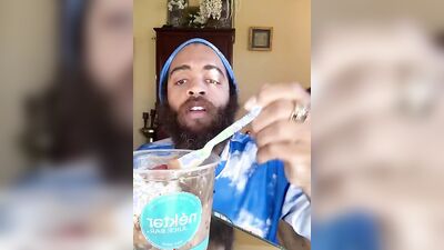 Handsome guy with a sexy beard does a smoothie bowl review