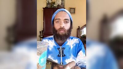 Handsome guy with a sexy beard does a smoothie bowl review